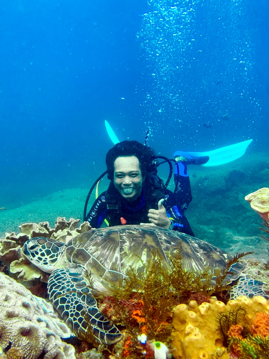 Smiling diver during training at a reef in Bali